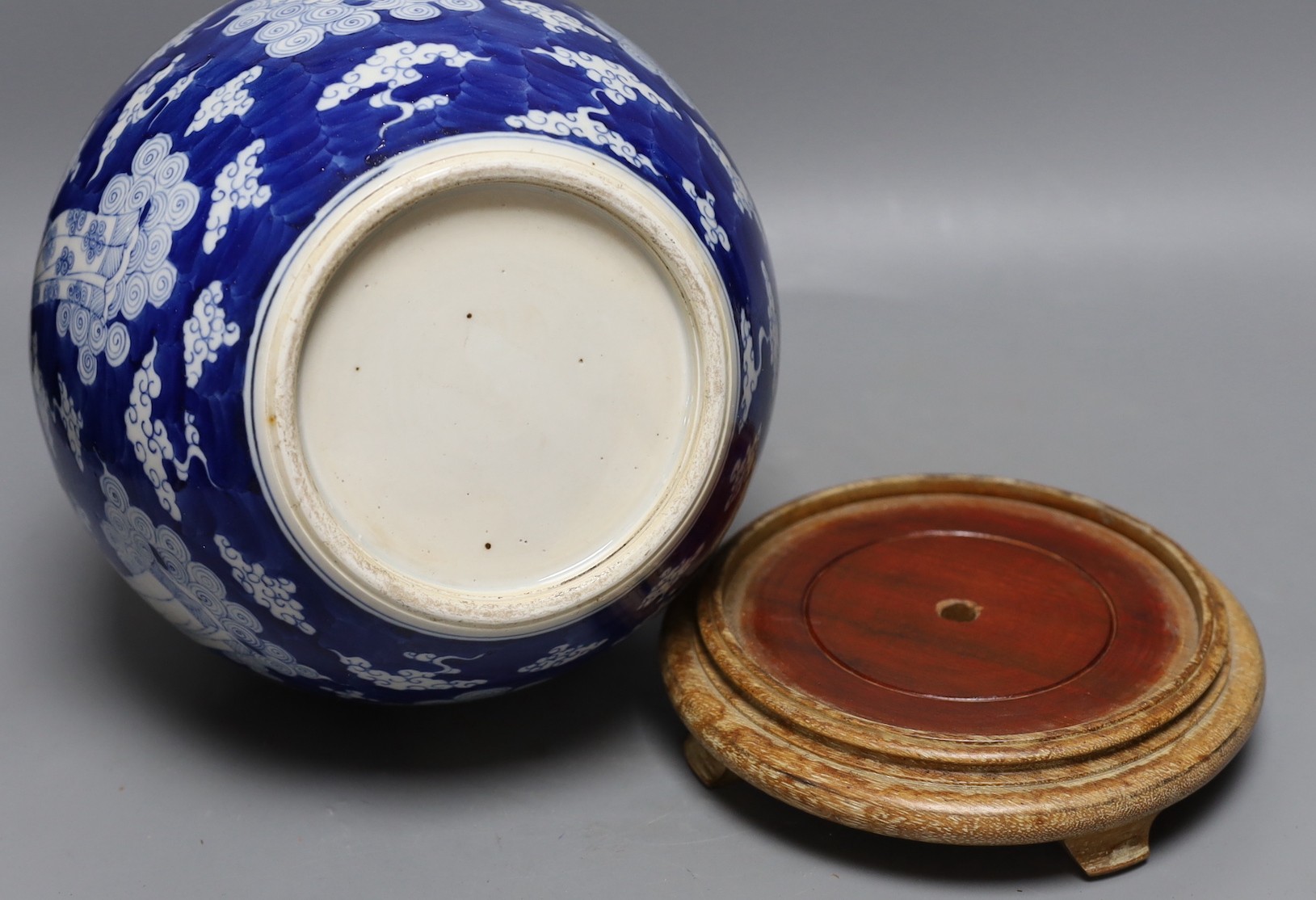 A Chinese blue and white figural vase on hardwood stand, 40cm total height